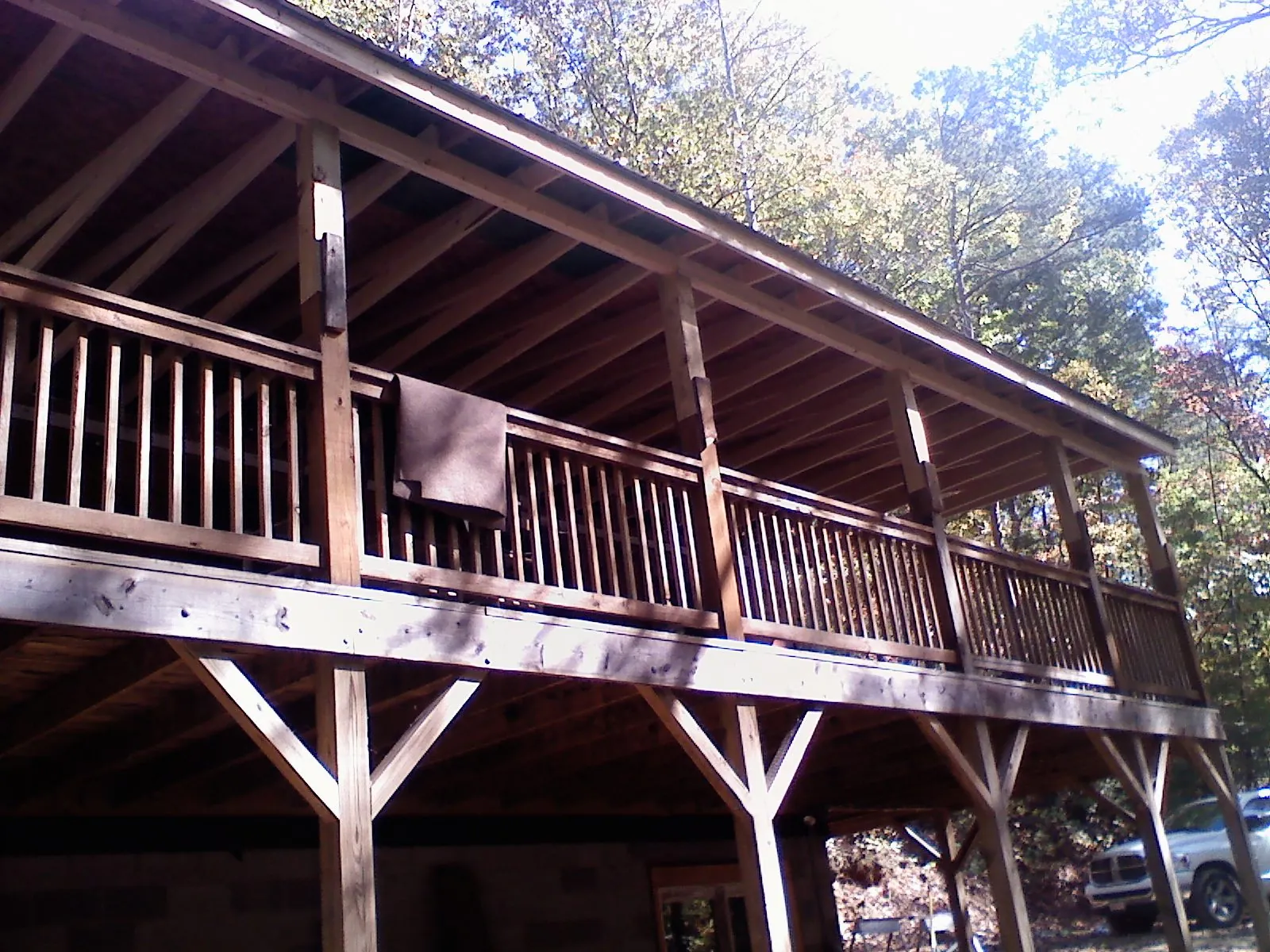 Timber framing under a new elevated porch and deck in Parker